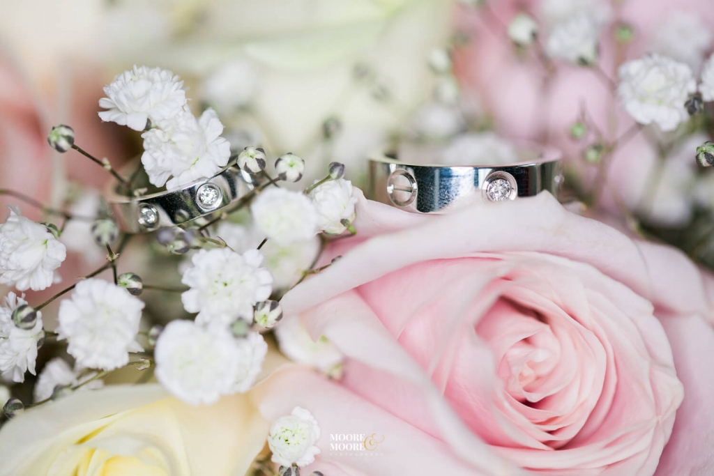 Bouquet and wedding rings. Tylney Hall Wedding Photography by Moore & Moore Photography, Hampshire