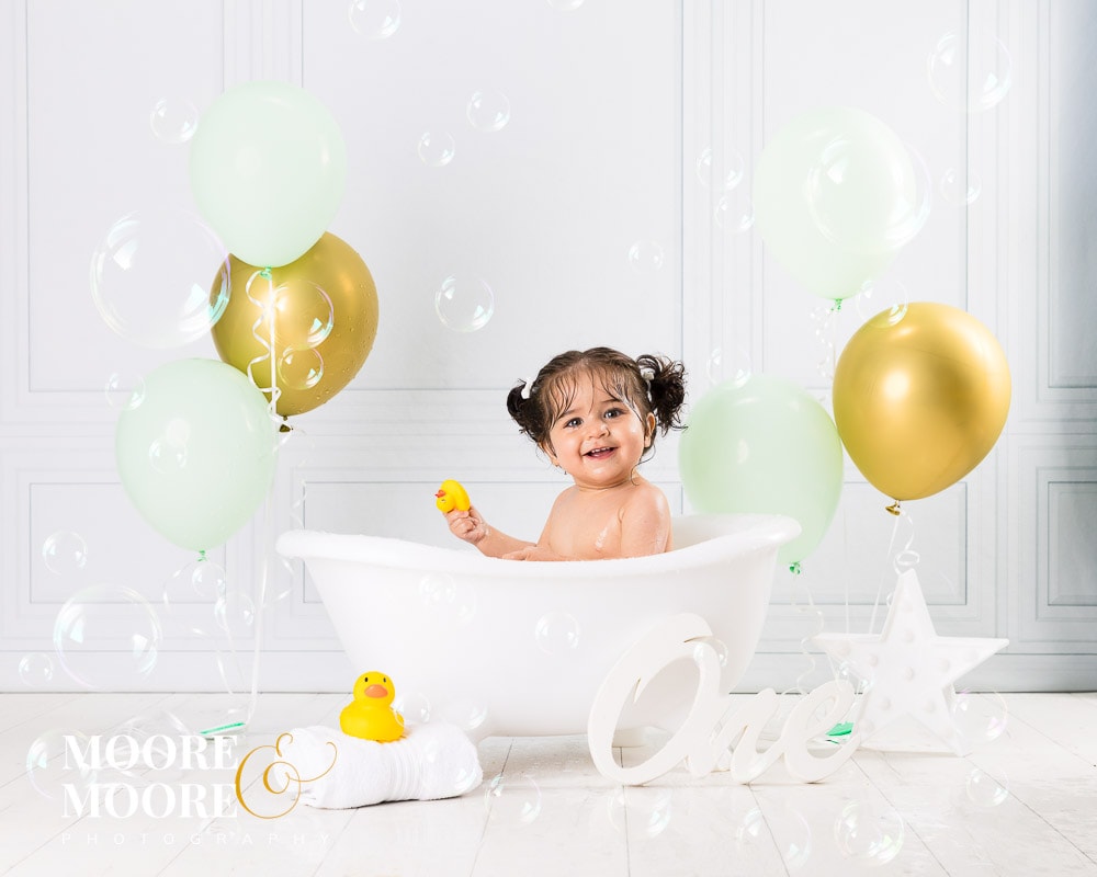 first-birthday-cake-smash-at-moore-moore-photography-5862 First Birthday Cake Smash and Splash Portraits in Fleet Hampshire by Moore & Moore Photography