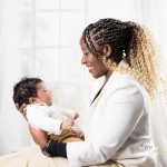 Mum holding her baby close, relaxed and connected