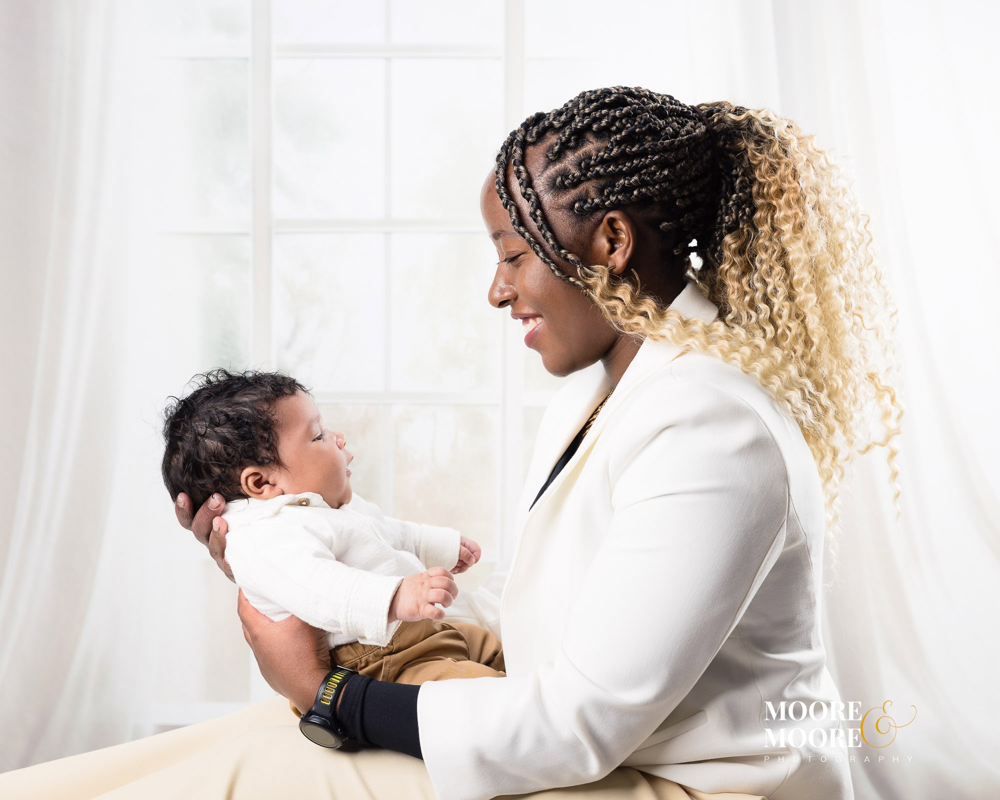 Mum holding her baby close, relaxed and connected
