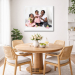 Framed family portrait displayed on the dining room wall, showing how meaningful artwork becomes part of everyday family life.