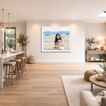 Large framed first birthday portrait displayed in a modern open-plan Hampshire family home, showing mother and baby embracing in a timeless outdoor image.