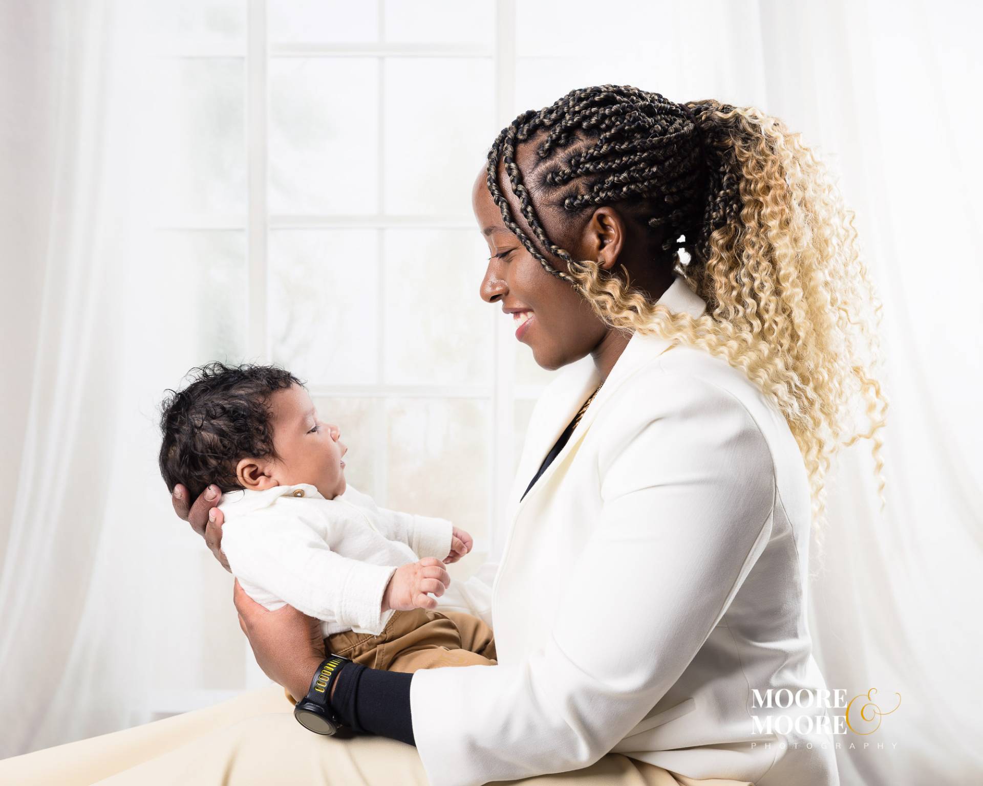 mother-and-baby-connection-first-year-portrait Mother holding her baby in a quiet moment of connection, reflecting the emotional bond that meaningful family artwork celebrates.