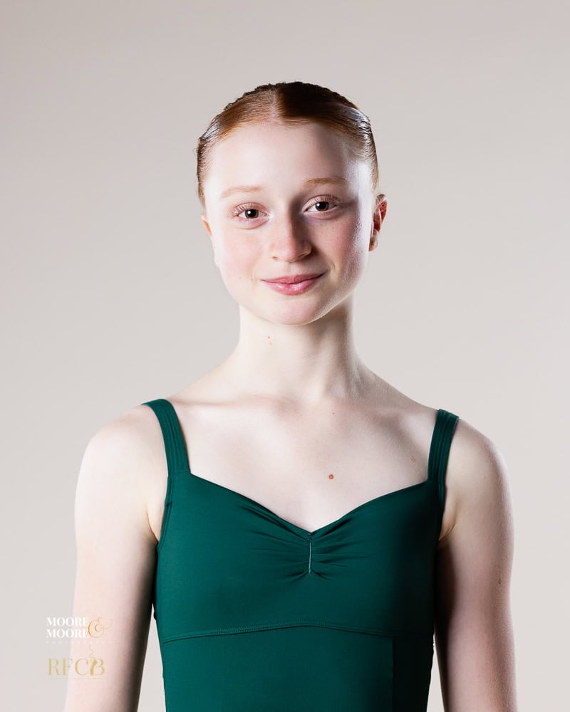 ballet-audition-headshot-green-leotard-hampshire Head-and-shoulders ballet audition portrait of a dancer wearing a green leotard